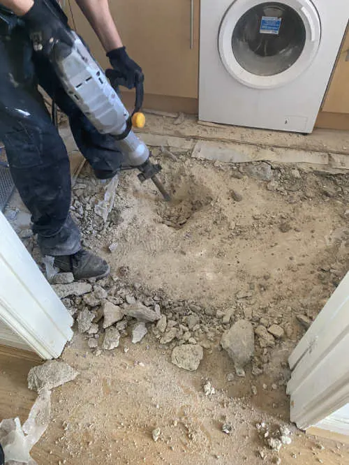 Internal drain repair beneath a domestic floor