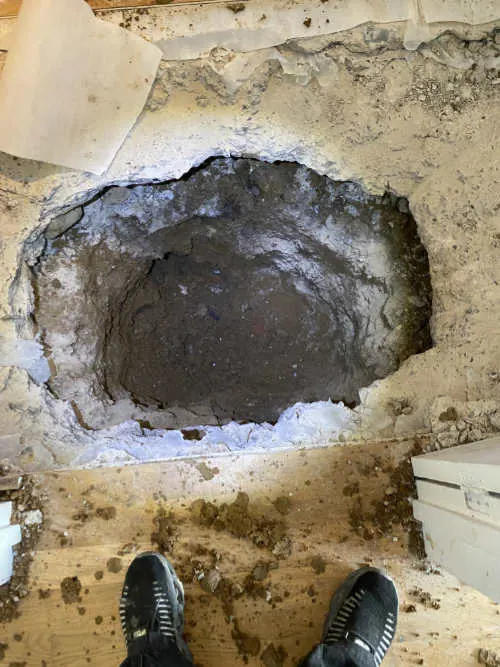 Excavating beneath a domestic floor for a drain repair