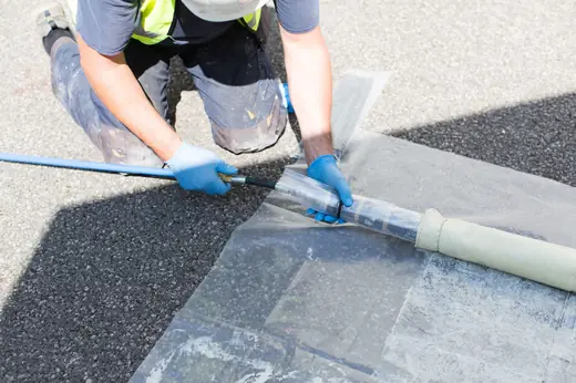Engineer reviewing CCTV drain survey footage