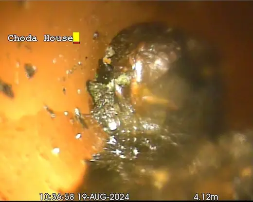 Collapsed drain line exposed during excavation
