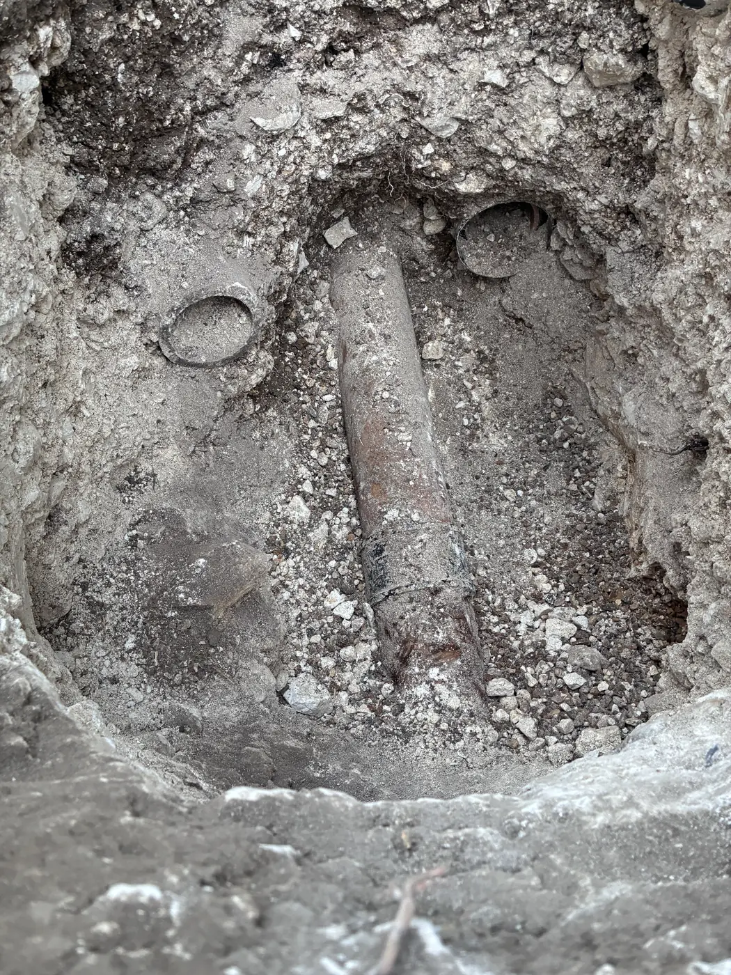 Existing drain runs exposed during excavation