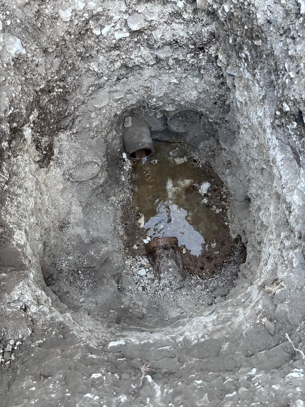 Defective drain section exposed for repair