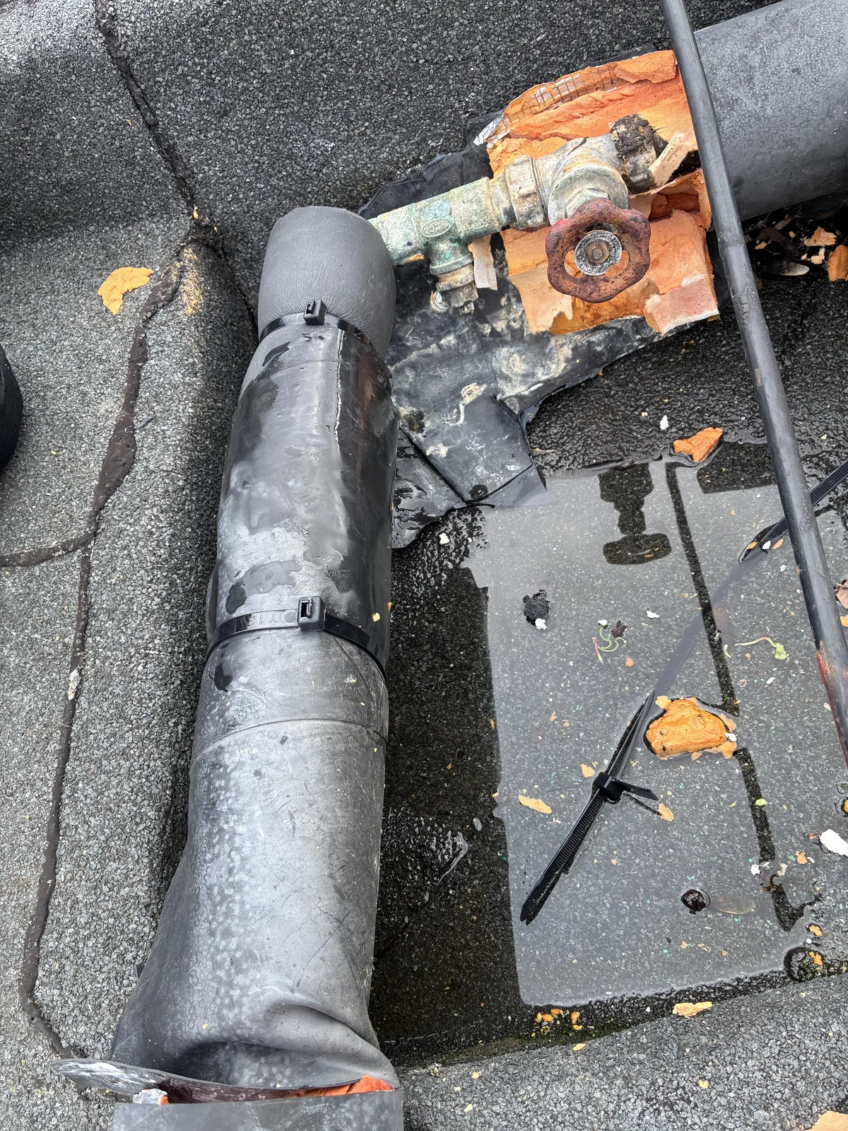 rooftop water pipe repair project photo